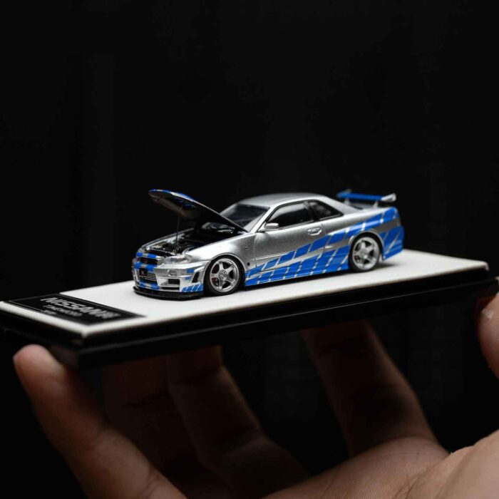Cool Art 1:64 Nissan GT-R R34 diecast model in blue and silver livery