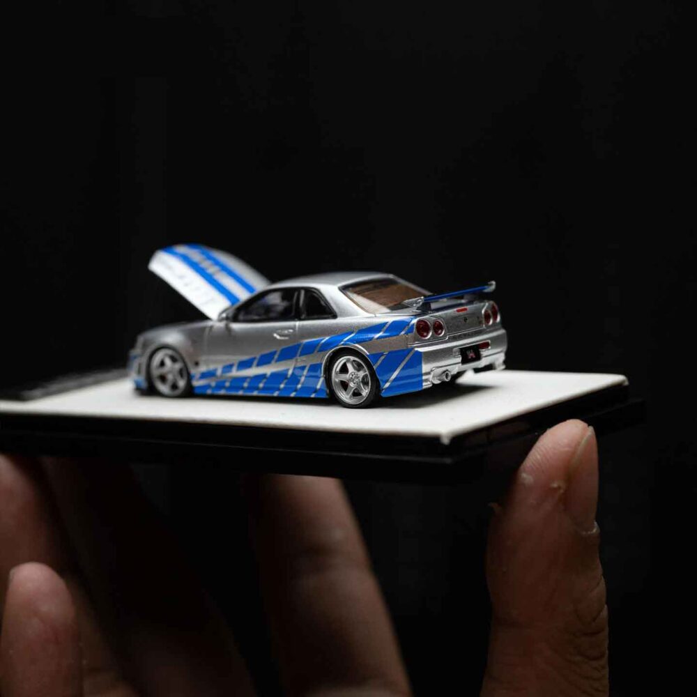 Cool Art 1:64 Nissan GT-R R34 diecast model in blue and silver livery