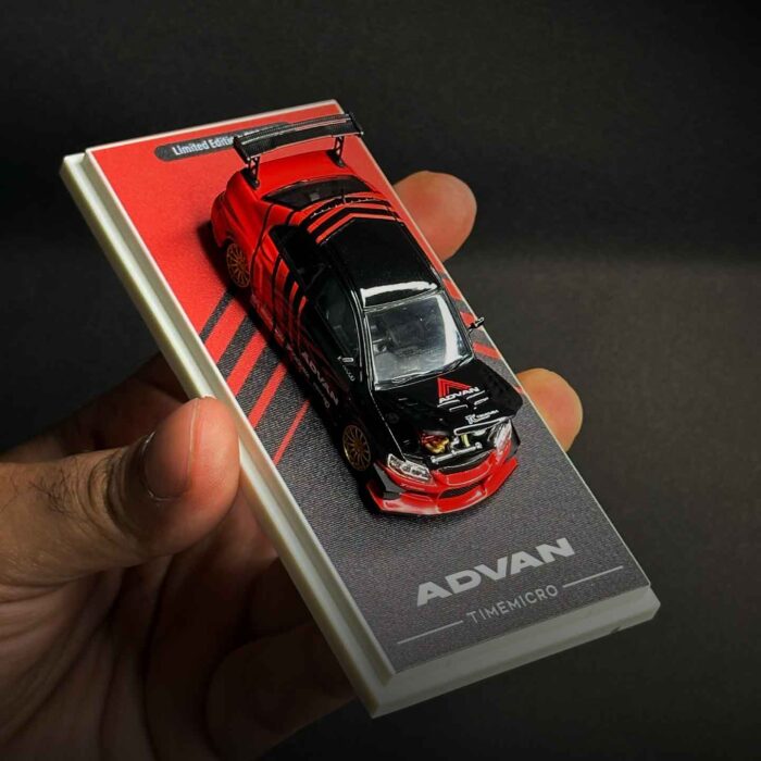 Time Micro 1:64 Mitsubishi Lancer Evolution IV diecast car in Advan racing livery