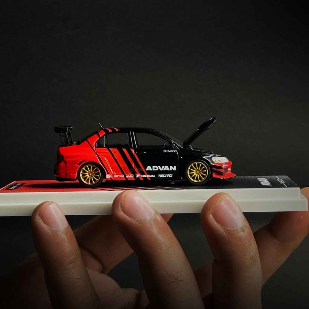 Time Micro 1:64 Mitsubishi Lancer Evolution IV diecast car in Advan racing livery