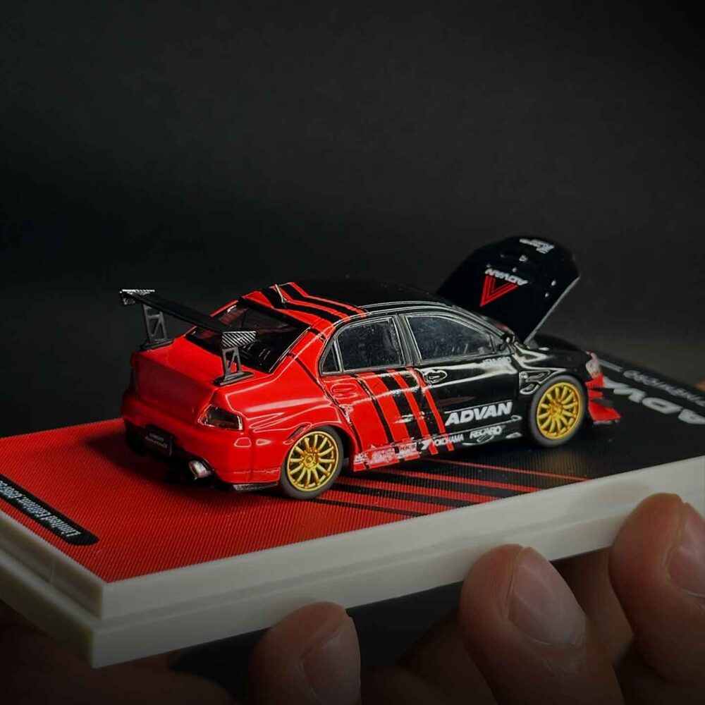 Time Micro 1:64 Mitsubishi Lancer Evolution IV diecast car in Advan racing livery