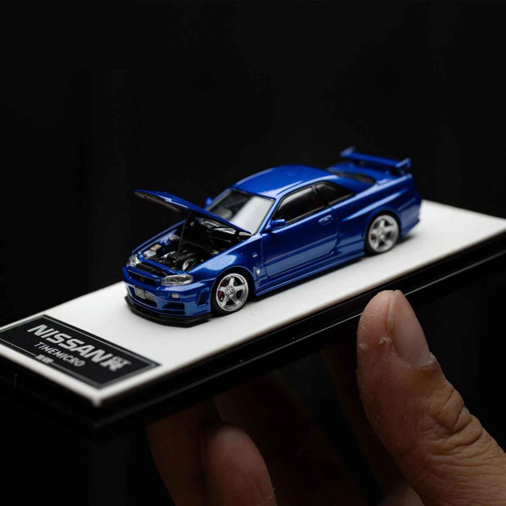 Cool Art 1:64 Nissan Skyline GT-R R34 diecast model in metallic blue
