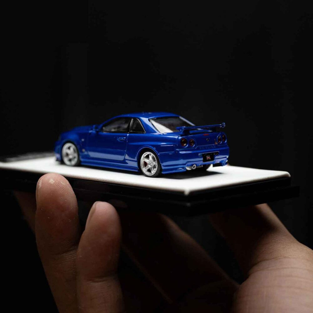 Cool Art 1:64 Nissan Skyline GT-R R34 diecast model in metallic blue