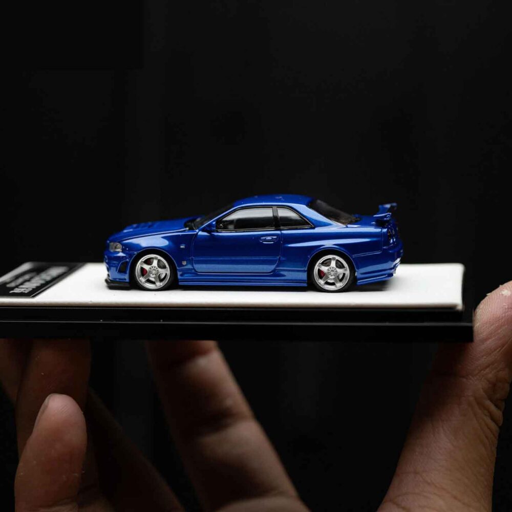 Cool Art 1:64 Nissan Skyline GT-R R34 diecast model in metallic blue