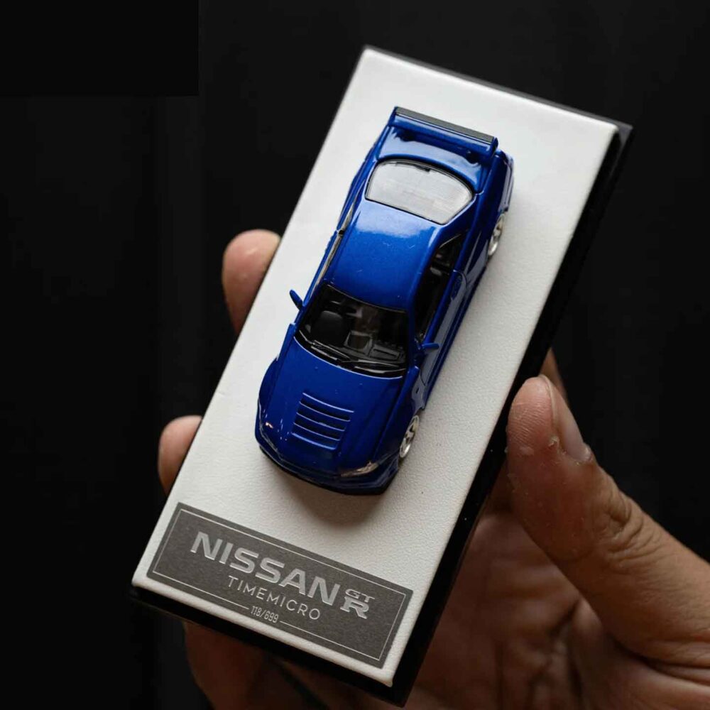 Cool Art 1:64 Nissan Skyline GT-R R34 diecast model in metallic blue