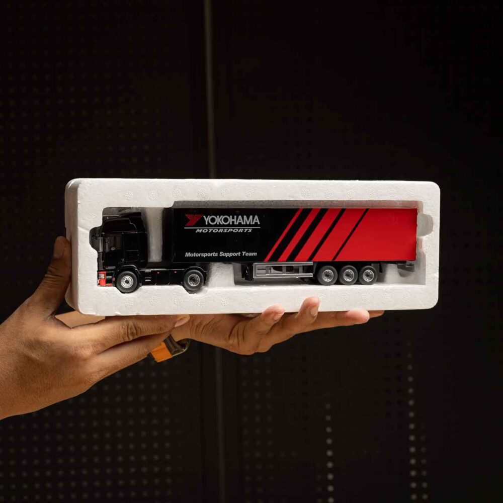 Advan 1:64 diecast container carrier trailer with red and black livery
