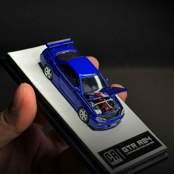 Cool Art 1:64 Nissan Skyline GT-R R34 diecast model in metallic blue