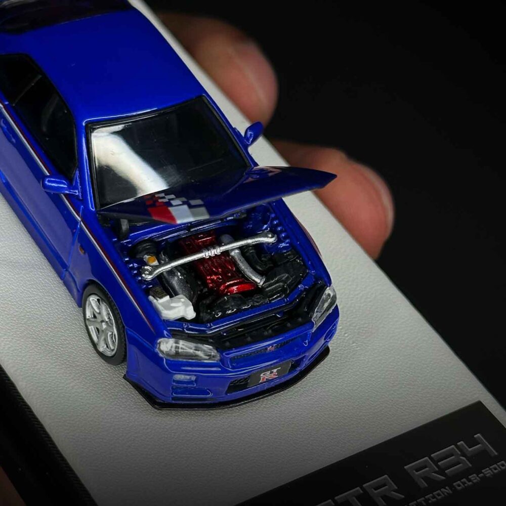 Nissan GT-R R34 1:64 diecast model in Speed and Passion Blue with widebody kit
