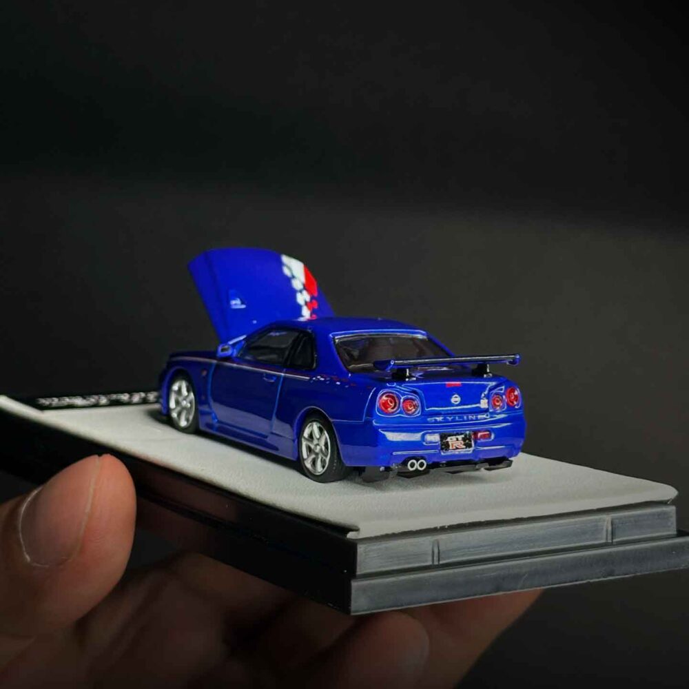 Nissan GT-R R34 1:64 diecast model in Speed and Passion Blue with widebody kit