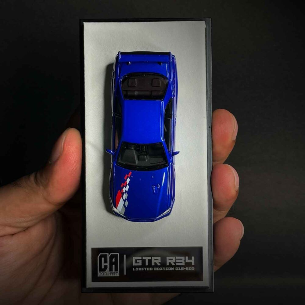 Nissan GT-R R34 1:64 diecast model in Speed and Passion Blue with widebody kit