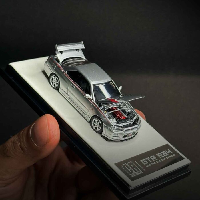 Cool Art 1:64 Nissan Skyline GT-R R34 diecast model in metallic silver