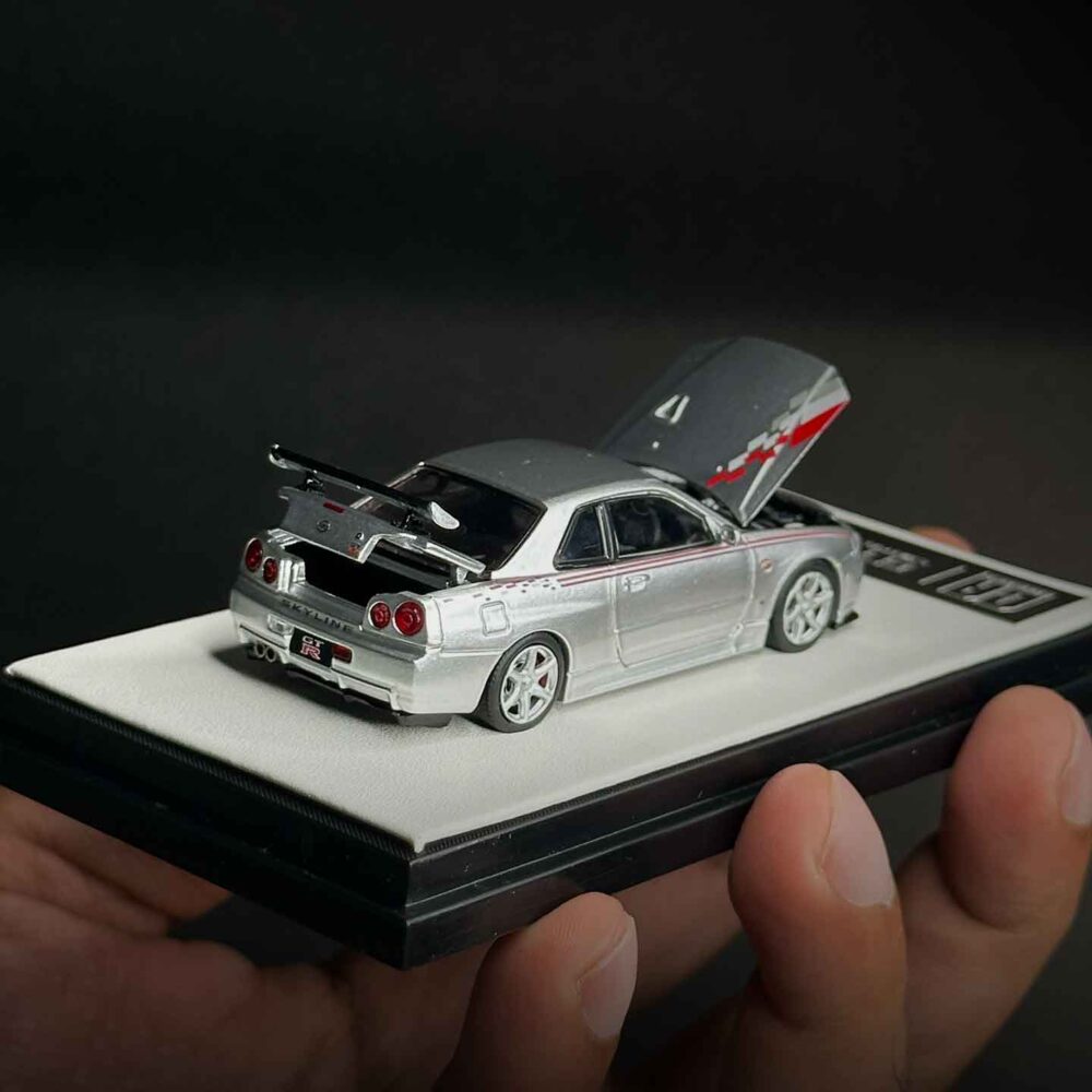 Cool Art 1:64 Nissan Skyline GT-R R34 diecast model in metallic silver