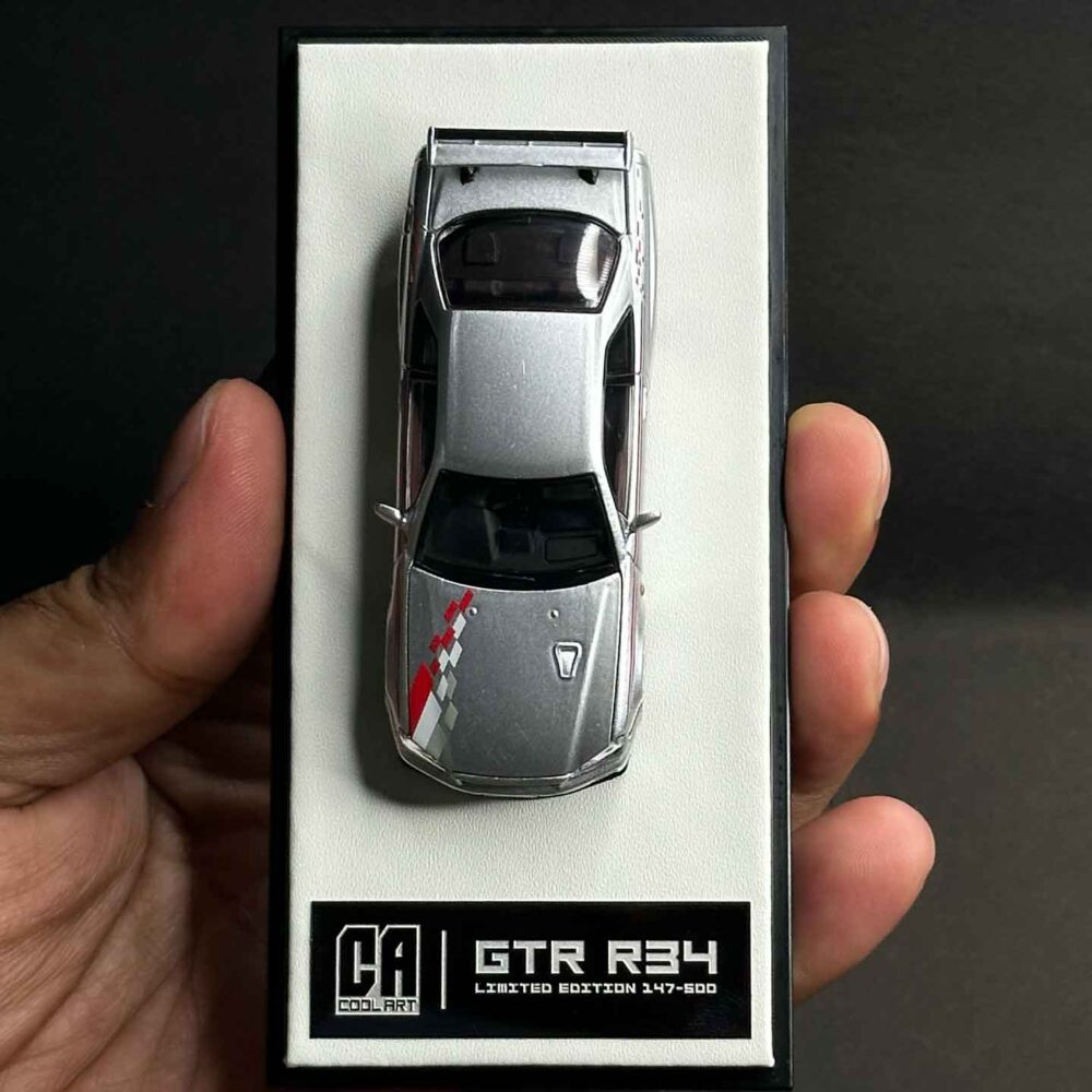 Cool Art 1:64 Nissan Skyline GT-R R34 diecast model in metallic silver
